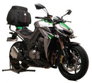 The image features the Ventura EVO-12 Bike-Pack Kit for the Kawasaki Z 1000 ABS/Ninja (14 ->) with a black and orange EVO-12 bag. It highlights the mounted Evo-Rack and accompanying L-Bracket with screws, showcasing seamless integration for your biking adventures.