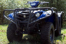 A Ventura Yamaha Grizzly 700 4x4 EPS (16 - >) ATV, in blue, is parked on grass amid green bushes. It features large rugged tires, a sturdy bull-bar, a front light, handlebar controls, and a protective front grille.