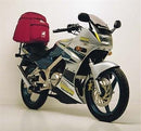Image of the Ventura Kawasaki KR 150 EVO-12 Bike-Pack Kit displaying an Adjustable Pack-Rack, Top-Box Rack, and L-Bracket with screws and bolts, all clearly labeled: EVO-12 Pack, EVO-Rack, and L-Bracket.