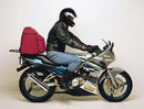 Image of the Ventura Kawasaki KR 150 EVO-12 Bike-Pack Kit displaying an Adjustable Pack-Rack, Top-Box Rack, and L-Bracket with screws and bolts, all clearly labeled: EVO-12 Pack, EVO-Rack, and L-Bracket.