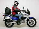 Ventura EVO-12 Bike-Pack Kit for Suzuki XF 650 V-K2 Freewind (97-02) includes an adjustable Pack-Rack, EVO-12 pack, and a labeled image of a black L-Bracket with screws and hardware.