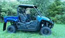 A black and white image displays the rear section of a Yamaha Viking / Viking VI (2018) with large tires and two Ventura mud flaps featuring a personalized logo, visibly showcasing the vehicle's body and part of its undercarriage.