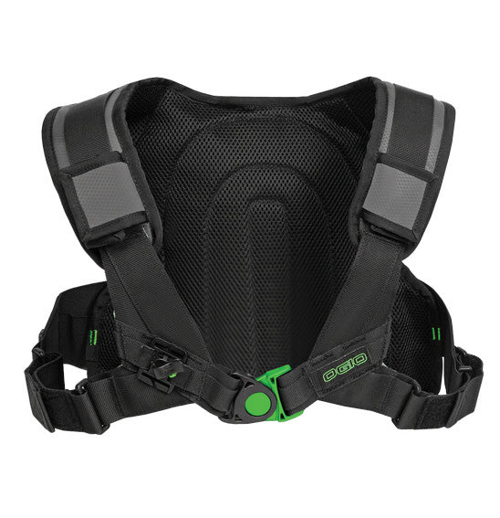 The Ogio ERZBERG 1L Hydration Bag in Black features a black ergonomic backpack harness with a multi-adjust harness system, padded shoulder straps, reflective gray strips, and adjustable black buckles. The back panel is constructed from breathable mesh material, and the front displays a green circular logo.