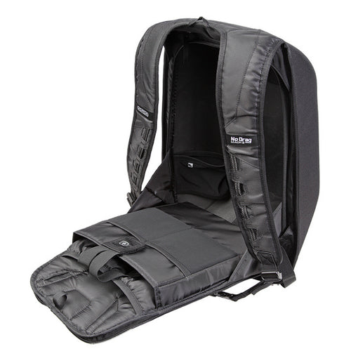 A black Ogio MACH 1 Motorcycle Backpack - Stealth with its front section unzipped and laid open, revealing multiple compartments and pockets inside, designed to securely carry laptops and other items. The "No Prgs" logo is visible on the interior. Featuring No Drag Technology, the padded straps provide comfort and enhance aerodynamic efficiency.