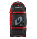A large, black and red O'NEAL x OGIO RIG 9800 Gear Bag by ONEAL is standing upright. This travel bag is designed with multiple compartments, zippers, and adjustable straps. The SLED system ensures extra durability, while the OGIO logo is prominently displayed on the front alongside the text "ENJOY THE RIDE.