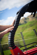 The LifeGuard ATV Crush Protection Device by City Honda Manawatu is a red and black lockable semicircular bar on a rectangular base, designed as an accessory for enhanced vehicle anti-theft protection.