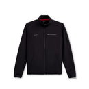 The Alpinestars Progression Midlayer Black jacket by Crown Kiwi Enterprises Limited boasts a high collar and a minimalist design. It features an embroidered logo on the right chest and sleeve, along with a red interior lining. The ergonomic stretch seams provide maximum comfort and flexibility, making it ideal for layering.