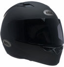 A Bell QUALIFIER Matte Black full-face motorcycle helmet is shown from a side angle, featuring an aerodynamic design with a smooth matte finish and a clear visor. The helmet includes a top vent for airflow, the "Bell" logo on the side, and Multi-Density EPS Liner for enhanced safety.