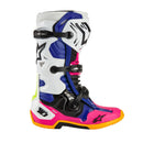 Introducing ALPINESTARS' Tech-10 MX Boots Coast LE with a striking design: one boot is blue with white and black accents, the other is pink with black and white. Both feature orange soles, dynamic heel compression protectors, distinctive buckles, and protective elements.