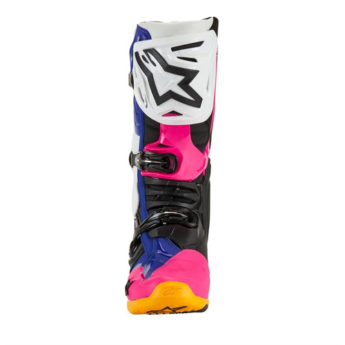 Introducing ALPINESTARS' Tech-10 MX Boots Coast LE with a striking design: one boot is blue with white and black accents, the other is pink with black and white. Both feature orange soles, dynamic heel compression protectors, distinctive buckles, and protective elements.