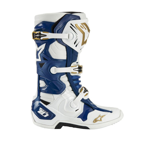 A pair of ALPINESTARS Tech-10 MX Boots Tropical in a striking white, blue, and gold color scheme. They include Dynamic Heel Compression Protector panels, adjustable buckles, and a rugged design for enhanced safety and performance.