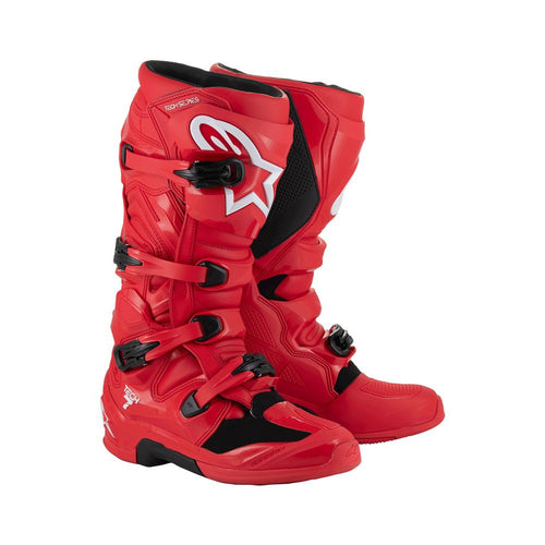 Tech-7 MX Boots Bright Red by Crown Kiwi Enterprises Limited feature white branding, adjustable buckles, and a high-grip sole. They're designed for off-road racing and prioritize performance and impact resistance for durability and safety on tough terrains.