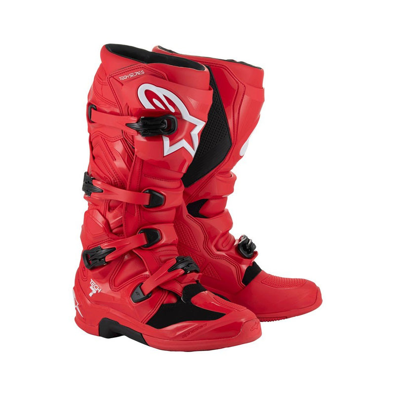 Tech-7 MX Boots Bright Red by Crown Kiwi Enterprises Limited feature white branding, adjustable buckles, and a high-grip sole. They're designed for off-road racing and prioritize performance and impact resistance for durability and safety on tough terrains.