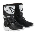 A pair of ALPINESTARS Tech 3 S Kids Mx Boots in black and white, featuring protective buckles, high ankle support, and a sporty design.