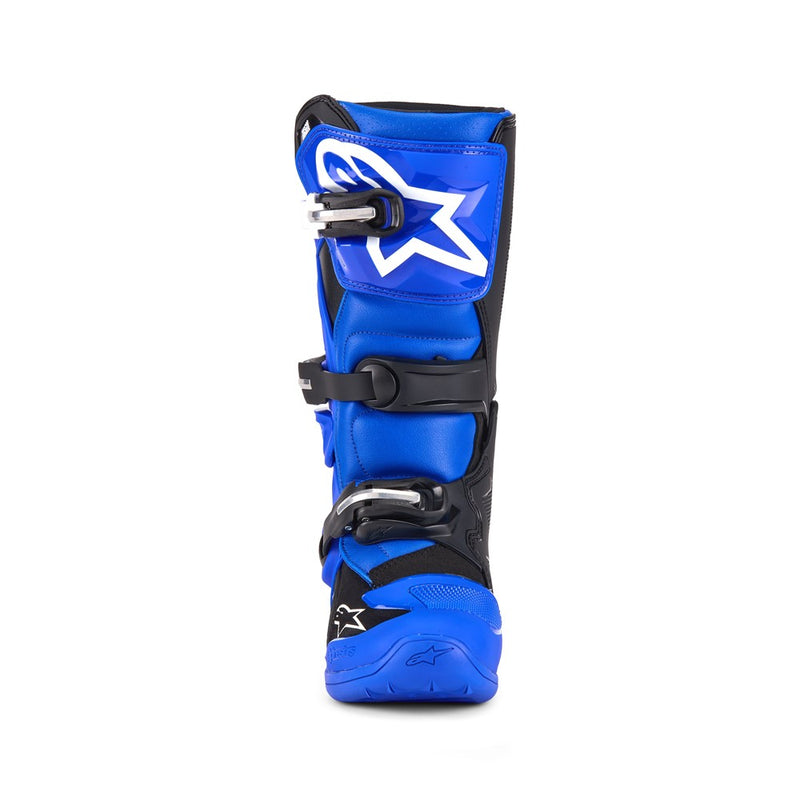 The ALPINESTARS Tech-7S MX Boots are shown; they feature a sleek design with blue and black accents, reinforced buckles, and a star logo on the side, offering enhanced protection and durability.