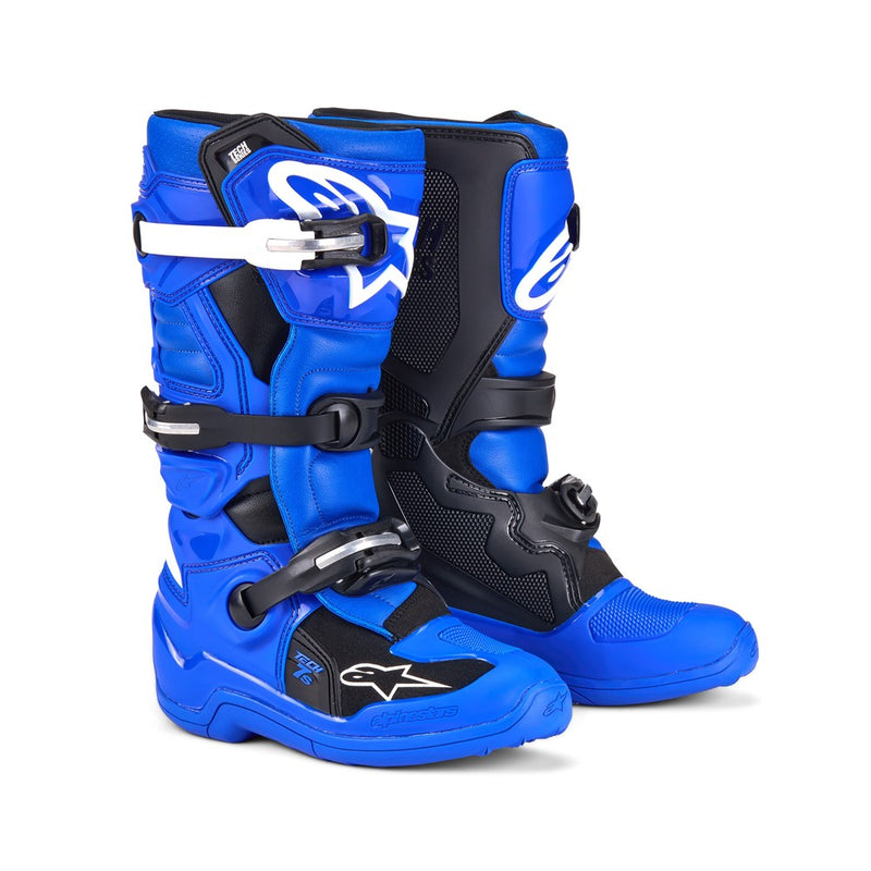 The ALPINESTARS Tech-7S MX Boots are shown; they feature a sleek design with blue and black accents, reinforced buckles, and a star logo on the side, offering enhanced protection and durability.