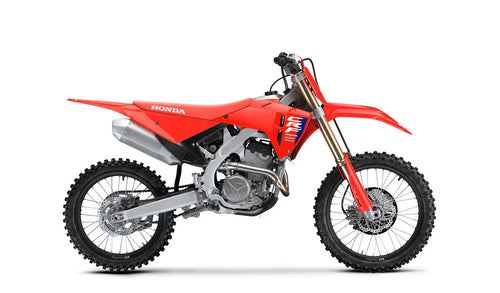 Side view of a red 2025 Honda CRF250R motocross dirt bike with black tires, visible spokes, and a silver exhaust pipe. The bike features the Honda logo on the seat and a number graphic on the side panel. Equipped with HRC Launch Control and a sturdy frame, it’s designed for optimal off-road use.