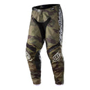 The Troy Lee Designs GP Pant Brazen Camo Army Green features black and green camo, reinforced black panels, breathable fabric, white branding on the left leg, and logo details on both knees.