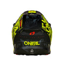 A top view of the O'Neal 5SRS ATTACK Helmet - Black/Neon showcases its striking graphic designs in neon yellow and white. The ABS shell construction ensures durability, with the ONEAL logo prominently displayed on the sides and top. Various branding and text, including a bold skull graphic, are imprinted around its surface.