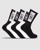 A set of five Unit Box Bamboo Hi Lux Socks against a gray background. Crafted from thermo-regulating bamboo fiber, these Unit socks alternate between black and white, each featuring a rectangular label with vertical lines and the text "HYPE" in black.