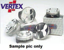 A display of high-quality VERTEX pistons is showcased, featuring several replacement pistons arranged on top of and around boxes branded with VERTEX. The text "Sample pic only" appears at the bottom of the image, with the Vertex logo visible at the top left corner. The product highlighted is the PISTON KIT VERTEX 94.95MM GAS GAS MC450F 21-23 HUSQVARNA FC450 16-22 KTM 450 SX F 16-22.