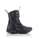 Introducing the Stella RT-7 Drystar Boots by Crown Kiwi Enterprises Limited: these black motorcycle boots deliver protective adventure touring features ideal for dedicated touring riders. Equipped with Velcro straps, reinforced soles, and a sleek design accented with white on the toe cap, they seamlessly blend style and safety.