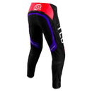 The Troy Lee Designs SE ULTRA PANT REVERB BLACK / GLO RED features Ultra Tech fabric, red, purple, and blue leg accents, “TLD” in white on the right thigh, and a white logo on the left knee.