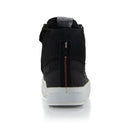 The Stella Stated Podium Shoes by Crown Kiwi Enterprises Limited are black high-top skate shoes designed with abrasion-resistant materials, featuring white soles and laces. The tongue includes a red pull tab for easy access. For a stylish display, the left shoe is positioned at an angle, slightly in front of the right.