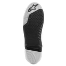 Close-up of the black and white ALPINESTARS Tech-10 Supervented Sole, featuring textured grip patterns and a distinct angular design. An embossed star logo is visible near the toe area, highlighting the supervented features for enhanced ventilation.