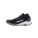Introducing the Meta XR v2 Shoes by Crown Kiwi Enterprises Limited: sleek black athletic trail running shoes featuring high ankle support and thick, rugged soles for superior grip. These shoes have a lace-up design with contrasting white accents, making them ideal for off-road running.