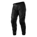 The Troy Lee Designs SCOUT SE PANT BLACK, shown upright on a white background, features reinforced knee and thigh areas, Articulated Knee Technology, zippered pockets, and an adjustable waist.