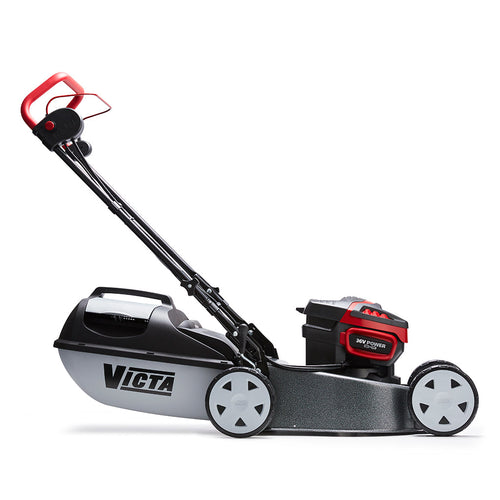 The Victa Corvette Twin 18" 18V Lawnmower - Kit features a sleek design with a black and red finish, complemented by a plastic grass collection bag at the rear. It includes a handlebar for easy pushing and four wheels for smooth maneuverability. Powered by Briggs & Stratton Batteries with advanced brushless motor technology, the mower proudly displays the "Victa" brand name on the side of its deck.