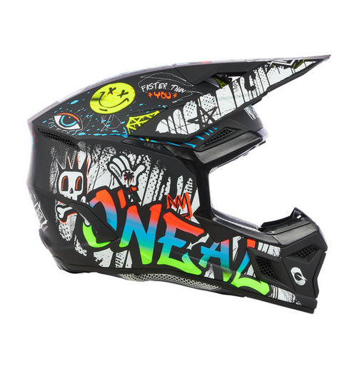 The O'Neal 2025 Youth 3SRS RANCID Helmet - Multi is a black motocross helmet adorned with vivid graffiti-style artwork. The intricate design showcases colorful letters spelling "ONEAL," various doodles, a crown, and multiple expressive faces and symbols. Featuring a Polycarbonate/ABS Shell, the helmet also includes a visor, chin guard for protection, and a washable padded liner for added comfort.