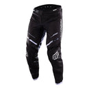 The Troy Lee Designs GP PRO PANT BLENDS CAMO BLACK / WHITE features white graphics and logos on black, made from durable 600D polyester with reinforced knee panels and a partially elastic waistband, shown against a white background.