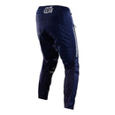 The Troy Lee Designs GP PRO PANT MONO NAVY motocross pants, made from durable 600D polyester, feature white logos on the left thigh and right knee and are shown standing upright on a white background.