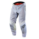 The Troy Lee Designs GP PRO AIR PANT APEX in Charcoal/Gray features reinforced knee panels, black logo graphics, and a secure waist closure for protection and flexibility during motocross riding.