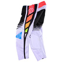 The Troy Lee Designs YOUTH GP PRO PANT WAVEZ BLACK / MULTI features bold black, white, red, yellow, and blue geometric patterns with logo patches and is made from durable 600D polyester for top performance in moto kits.