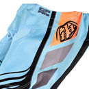 The Troy Lee Designs YOUTH GP PRO PANT WAVEZ BLEACHED AQUA features a vibrant geometric design in light blue, white, black, and orange panels, crafted from durable 600D polyester.