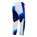 The Troy Lee Designs YOUTH GP PRO PANT LUCID WHITE / BLUE features a blue and white gradient, red "Troy Lee Designs" logos on the thighs, a black waistband, and is made from durable 600D polyester.