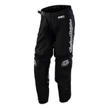 The Troy Lee Designs YOUTH GP PRO PANT MONO BLACK features white branding on the right thigh and waistband, shown against a white background—ideal for creating a complete motocross kit.