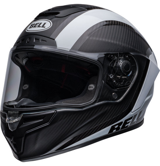 Side view of the Bell RACE STAR DLX FLEX Tantrum 2 Black/White helmet with a clear visor. The helmet boasts a sleek design with aerodynamic contours, Velocity Flow Ventilation, and a textured pattern on the top and sides. A Carbon Fiber Shell ensures durability, while the BELL logo is prominently displayed.