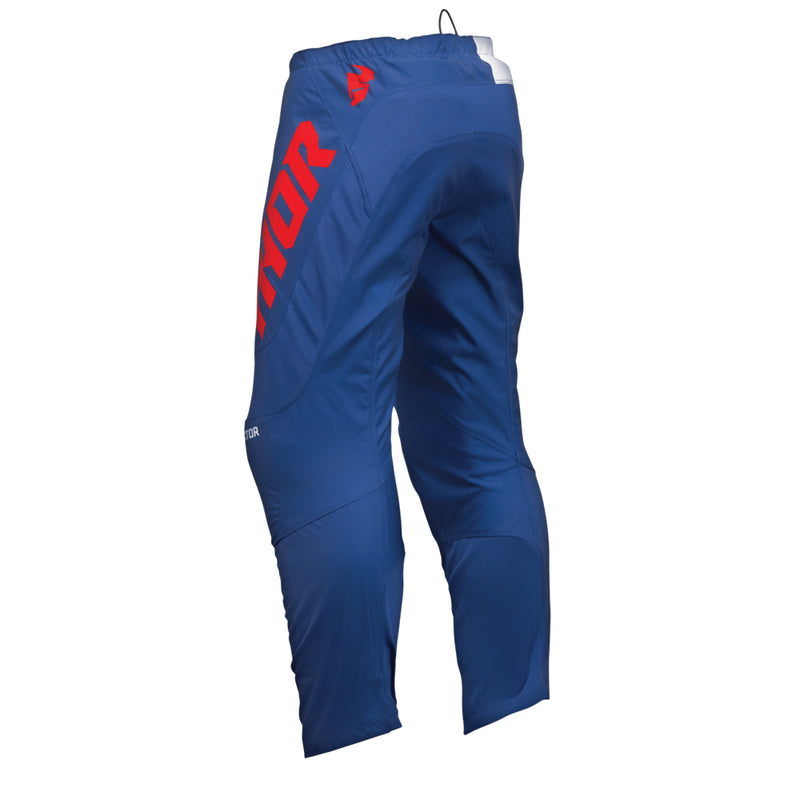 The THOR SECTOR CHECKER PANTS in NAVY/RED, part of the Sector Collection by THOR MX, are designed for rider mobility and comfort with reinforced knees and a tapered fit to enhance durability during sports activities. They feature red lettering on the side.