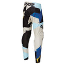 The THOR MX PANTS SPORT BRAVE BLUE are racewear essentials featuring abstract patterns in blue, yellow, black, and white. These colorful motocross pants are designed for unrestricted mobility, with the brand name "THOR" boldly printed on the side to enhance athletic performance.