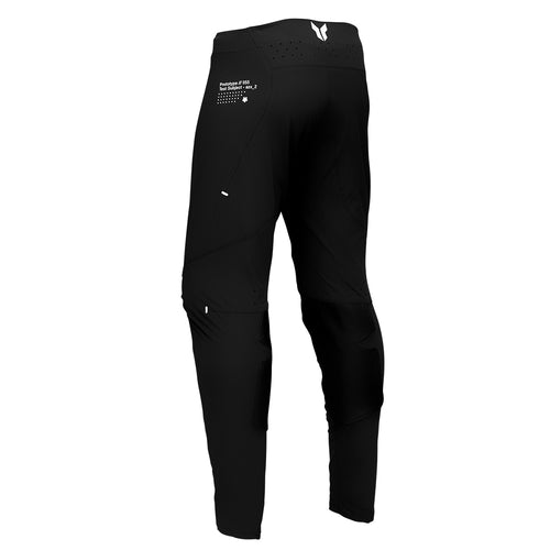 These THOR MX pants, known as the THOR PANTS SPORT STRIKE BLACK, feature white accents and the iconic "THOR" logo on the left thigh. As part of the SPORTMODE collection, they ensure unrestricted mobility, with reinforced knee areas and a secure waist closure to boost athletic performance.