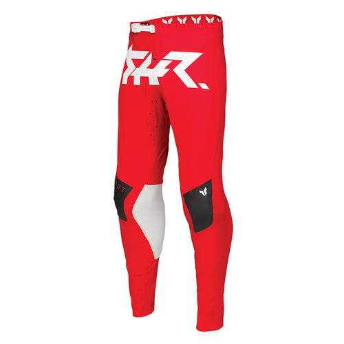 The THOR PANTS SPORT RIOT BLACK/RED by THOR MX offer a striking design with black, red, and white accents and a stylish logo. These pants are perfect for embodying motocross culture, featuring padded knee sections and a fitted waistband to ensure durability and comfort during off-road biking or racing activities.