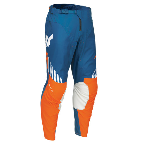 The THOR PANTS LAUNCH ZONE BLUE by THOR MX offer precision-fit comfort with their blue and orange poly stretch fabric, accented by white details. These motocross pants feature reinforced knee areas and ventilation for improved performance, incorporating a white wing-like logo and a white stripe pattern on the sides, exemplifying the LAUNCHMODE excellence.