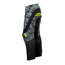 Youth motocross pants from THOR MX's Sector Collection, featuring a camouflage pattern with black accents and yellow logo details, presented against a white background.