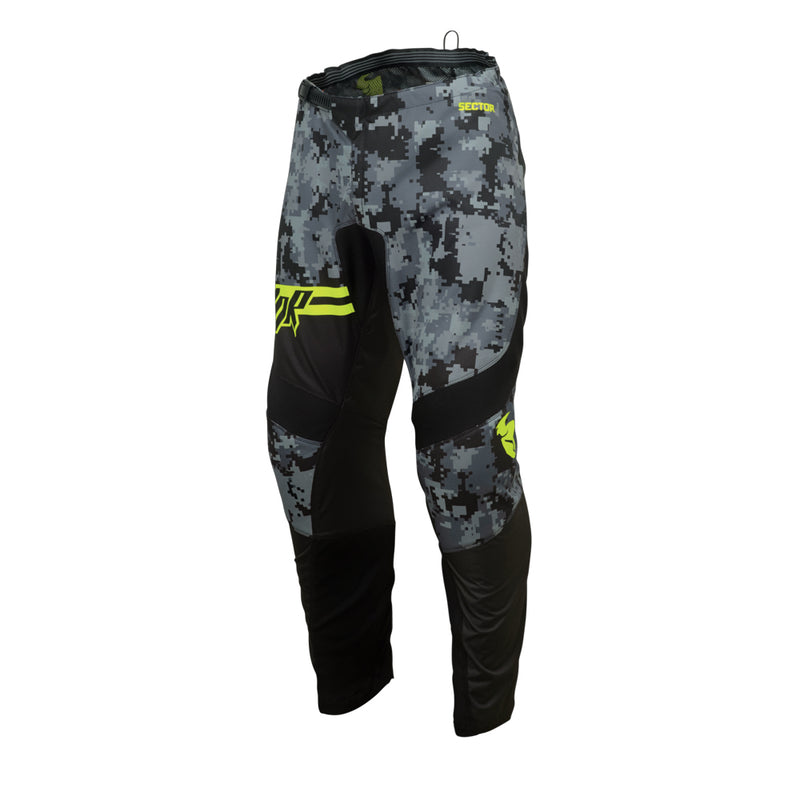 Youth motocross pants from THOR MX's Sector Collection, featuring a camouflage pattern with black accents and yellow logo details, presented against a white background.