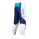 The THOR MX Launch Youth Storm White pants are crafted with durability in mind, showcasing a white fabric enhanced with blue and black accents. They feature padded knees for protection, a flexible and moisture-wicking design, and proudly display the brand name "Thor" printed vertically on the side.