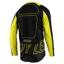 The Troy Lee Designs SE PRO JERSEY DROP IN BLACK / GLO YELLOW is a long-sleeve mountain bike jersey with black sleeves and side panels, Racer Fit for performance, and features bold "Troy Lee Designs" logos in black and yellow.
